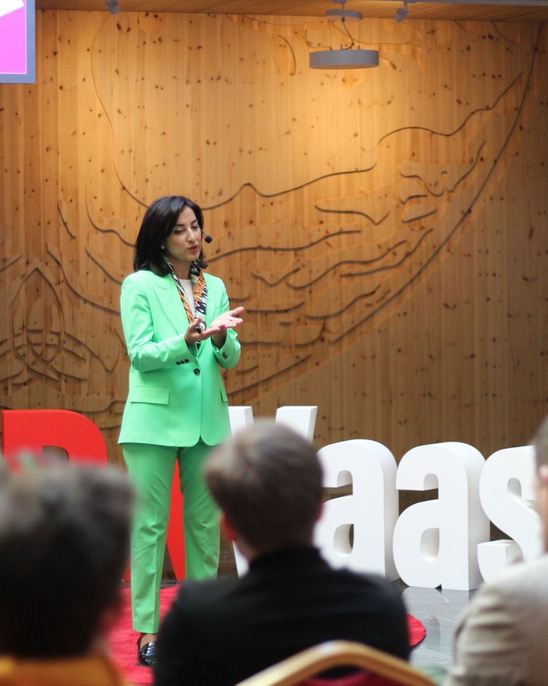 Kamilla Sultanova speaking at TEDxVaasa 2025 on trust in the AI and power-driven world